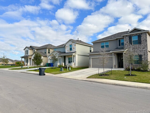 view of front facade featuring a garage and a front yard