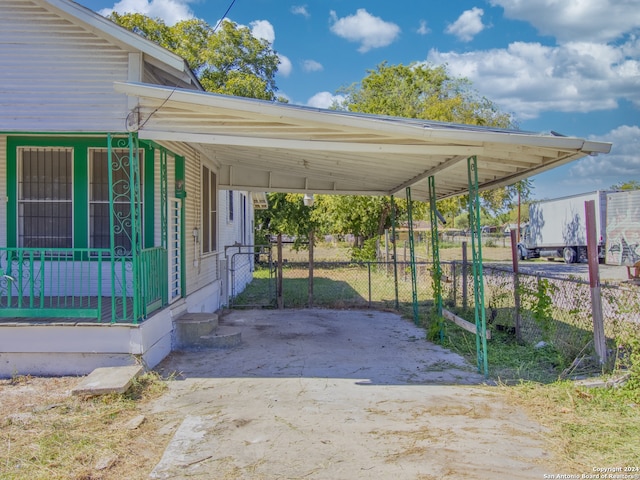 view of parking / parking lot with a carport