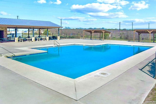 view of pool with a gazebo and a patio