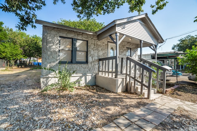 view of front of property featuring covered porch