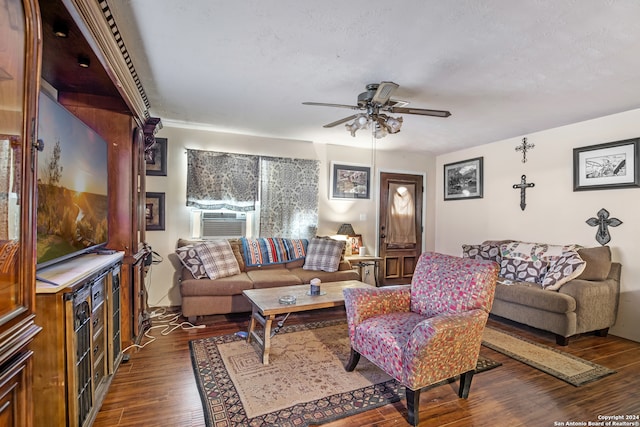 living room featuring ceiling fan, cooling unit, and dark hardwood / wood-style flooring