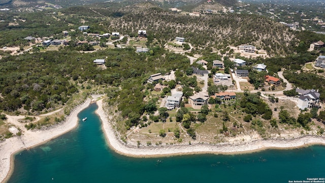 drone / aerial view with a water view and a beach view