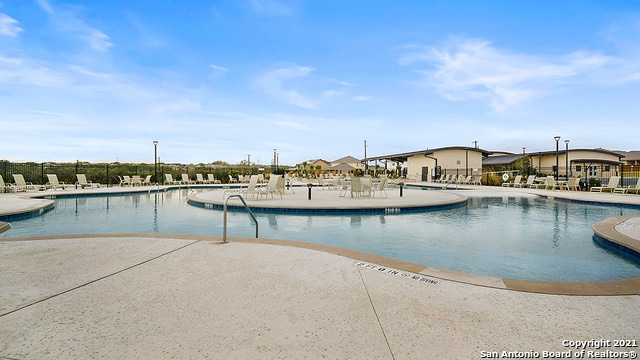 view of swimming pool featuring a patio area