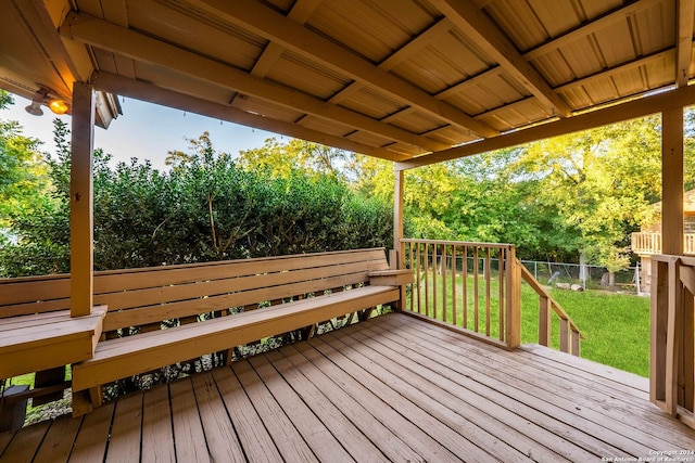 wooden terrace with a yard