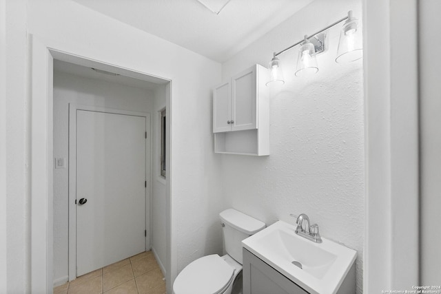 bathroom featuring vanity, toilet, and tile patterned floors