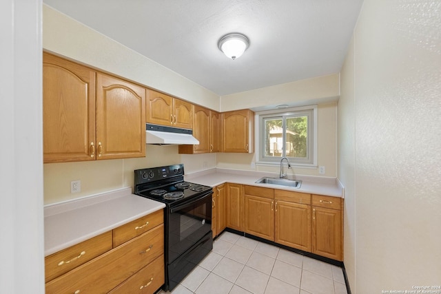 kitchen with light tile patterned flooring, black electric range oven, and sink