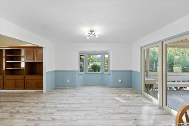 empty room with light wood-type flooring