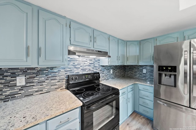 kitchen with tasteful backsplash, black electric range, light hardwood / wood-style flooring, stainless steel fridge with ice dispenser, and blue cabinetry