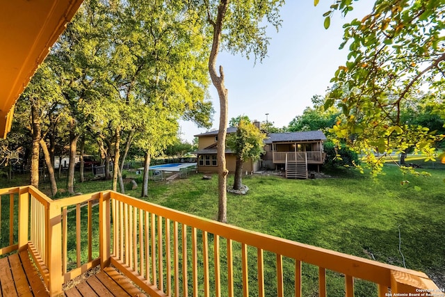 wooden terrace with a yard