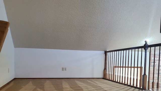 bonus room featuring light colored carpet