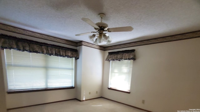 unfurnished room featuring a textured ceiling and ceiling fan