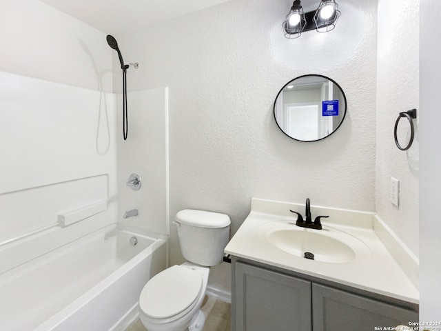 full bathroom featuring vanity, toilet, and washtub / shower combination