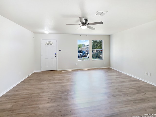 foyer with ceiling fan and light hardwood / wood-style floors