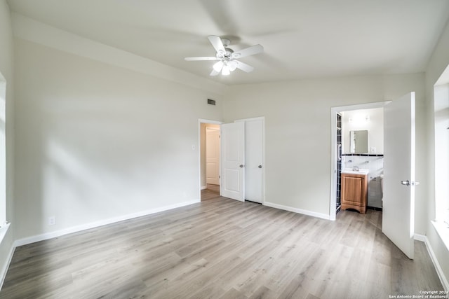 119 Rolling Grn, San Antonio, TX 78228 - unfurnished bedroom featuring visible vents, baseboards, vaulted ceiling, and light wood finished floors