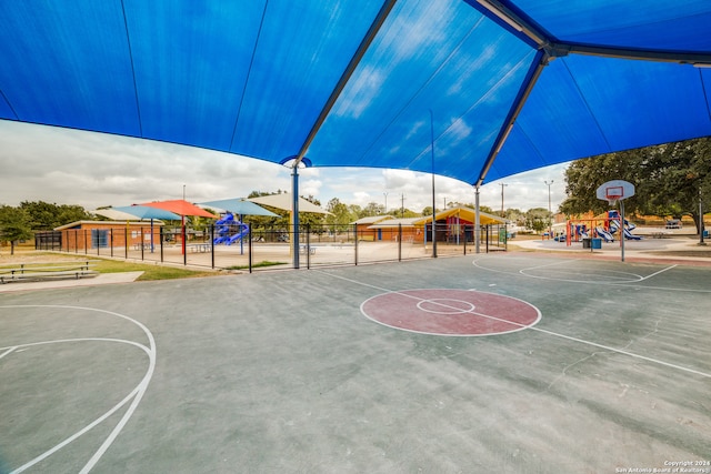 view of sport court featuring a playground