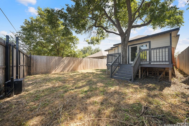 view of yard featuring a wooden deck