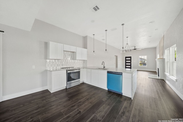 kitchen featuring dark wood-type flooring, sink, kitchen peninsula, white cabinets, and appliances with stainless steel finishes