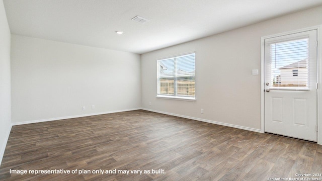 spare room featuring hardwood / wood-style floors