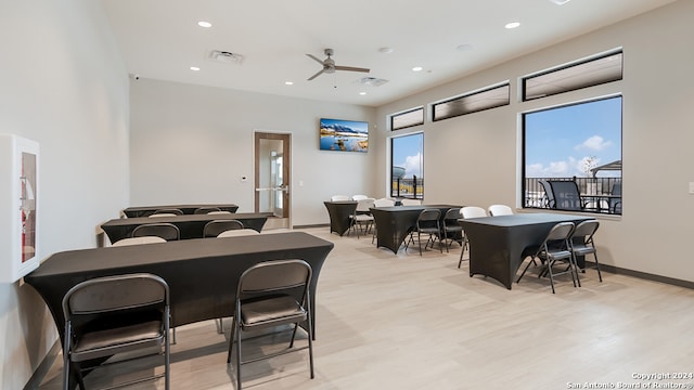 dining area with ceiling fan and light hardwood / wood-style flooring