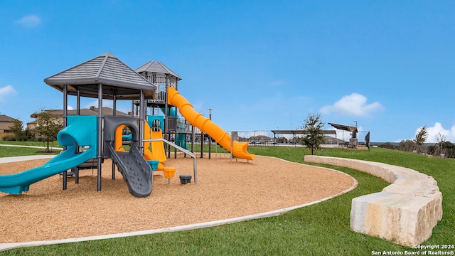 view of jungle gym with a yard