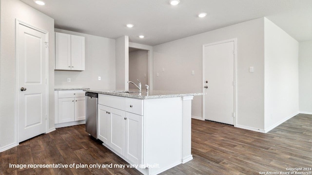 kitchen featuring an island with sink, dark hardwood / wood-style flooring, stainless steel dishwasher, and white cabinets