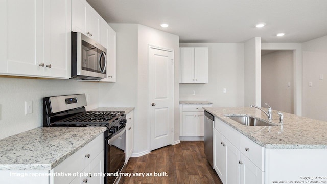 kitchen with sink, a center island with sink, white cabinetry, appliances with stainless steel finishes, and dark hardwood / wood-style flooring