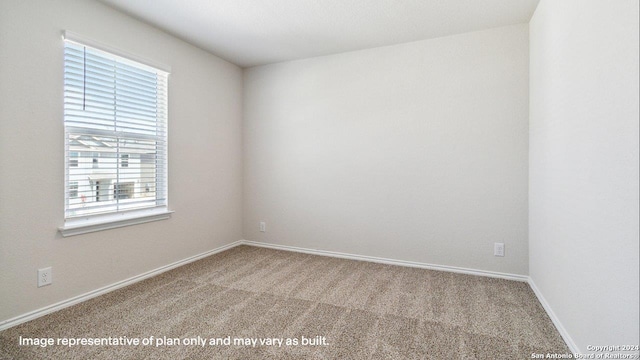 empty room with carpet flooring