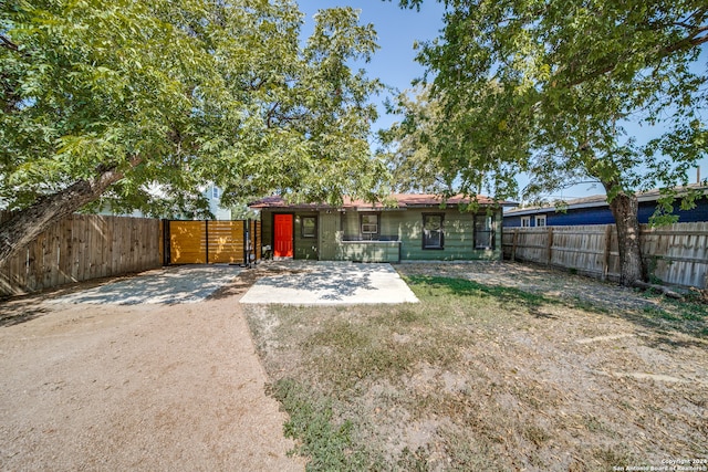 rear view of house with a patio