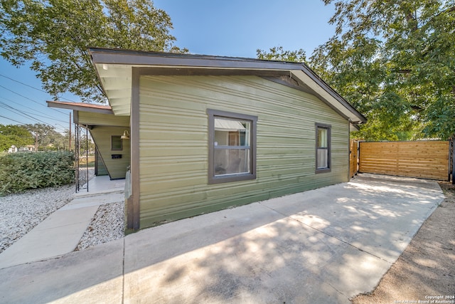 view of property exterior featuring a patio area