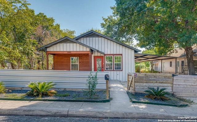 view of front of property featuring a carport