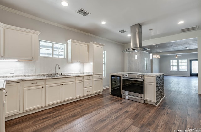 kitchen featuring island range hood, sink, dark hardwood / wood-style flooring, and electric range