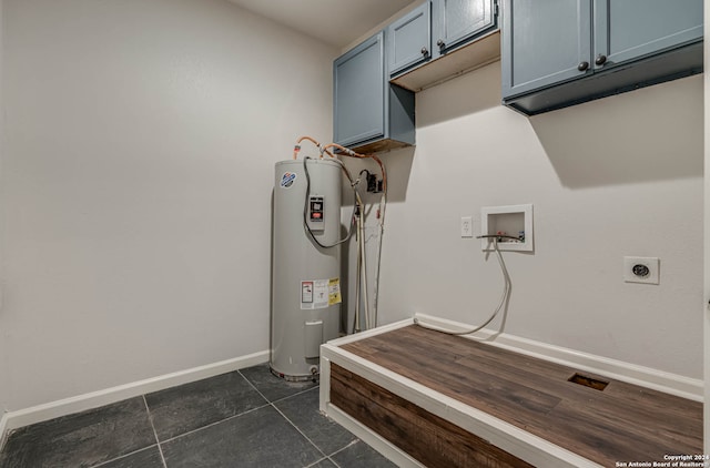 clothes washing area featuring washer hookup, dark tile patterned floors, cabinets, electric water heater, and hookup for an electric dryer