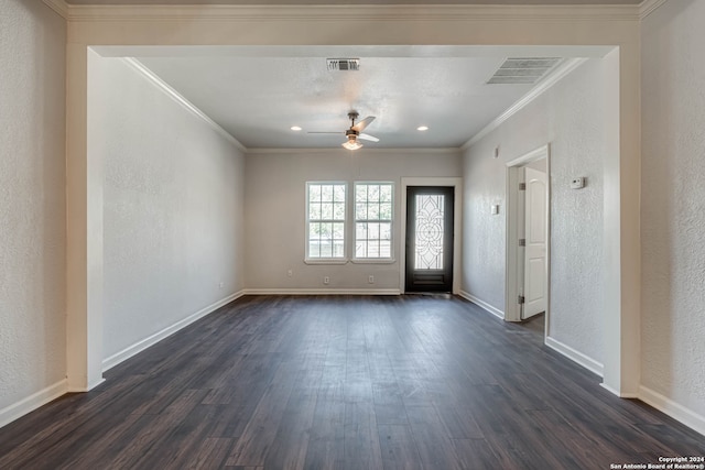 empty room featuring crown molding, ceiling fan, and dark hardwood / wood-style flooring