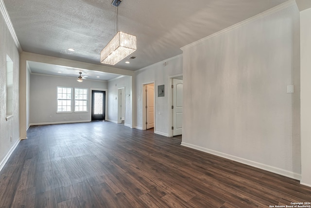 unfurnished room with ceiling fan, dark hardwood / wood-style floors, and ornamental molding