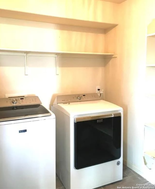 laundry area with washing machine and clothes dryer