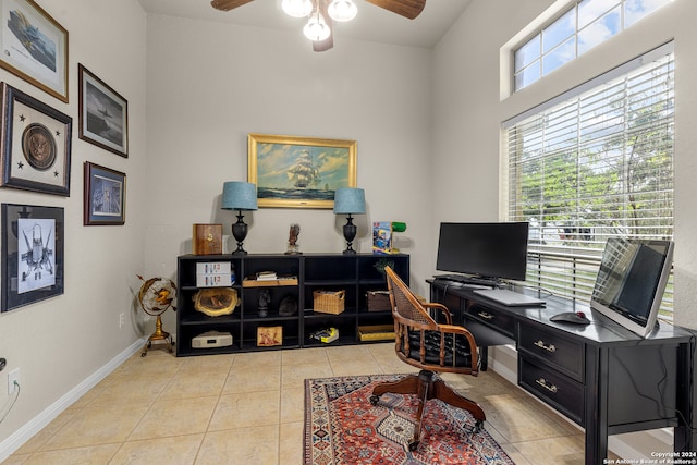 tiled office featuring ceiling fan