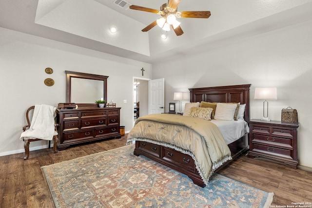 bedroom featuring ceiling fan, dark hardwood / wood-style floors, and high vaulted ceiling