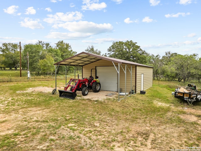 view of outbuilding with a carport and a lawn