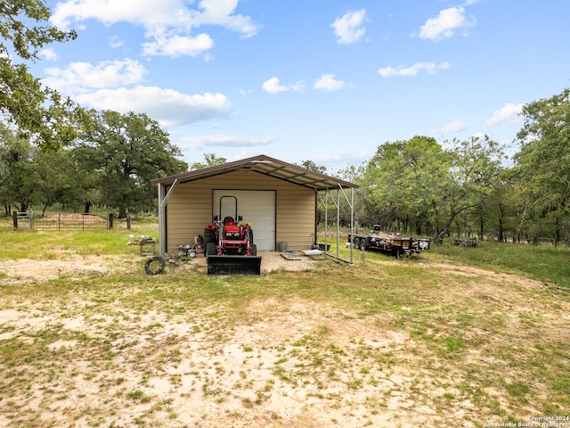 view of outbuilding with a carport