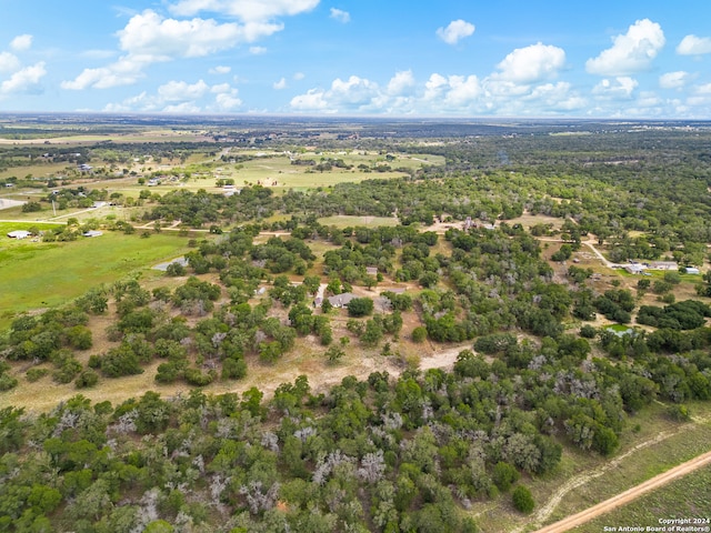 birds eye view of property featuring a rural view