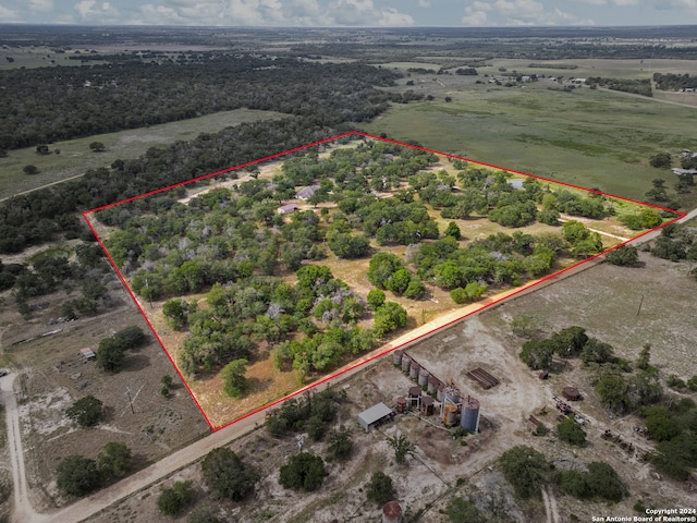 birds eye view of property featuring a rural view