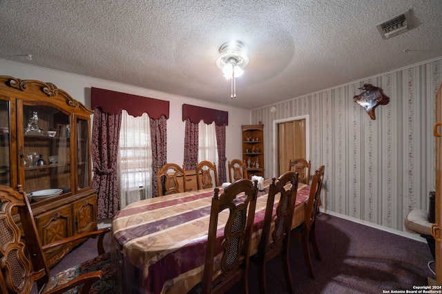 carpeted dining space featuring ceiling fan and a textured ceiling