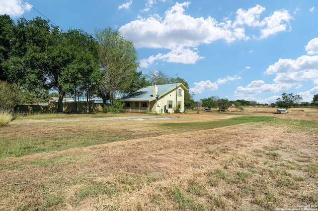 view of yard with a rural view