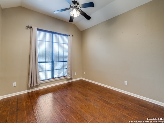 empty room featuring ceiling fan, wood-type flooring, and vaulted ceiling