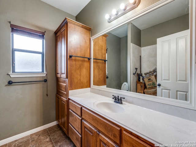 bathroom with tile patterned flooring and vanity