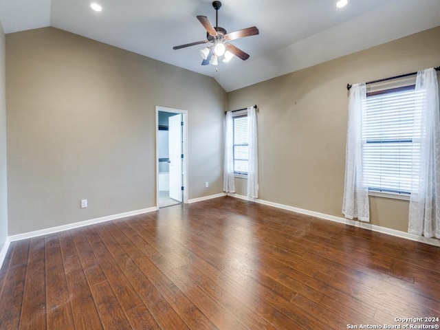 unfurnished room with wood-type flooring, lofted ceiling, baseboards, and ceiling fan