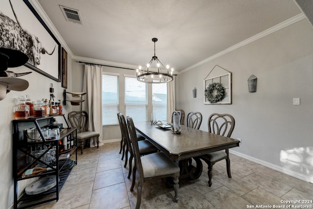 tiled dining room with ornamental molding and a notable chandelier