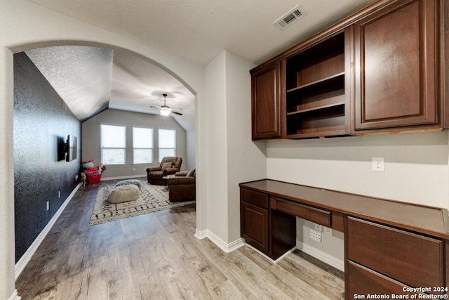 4815 Isaac Ryan, San Antonio, TX 78253 - home office featuring a ceiling fan, visible vents, vaulted ceiling, built in desk, and light wood-style flooring