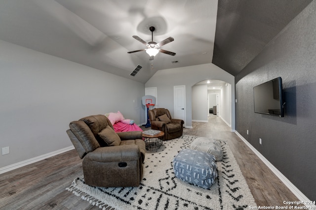 interior space with lofted ceiling, hardwood / wood-style flooring, and ceiling fan