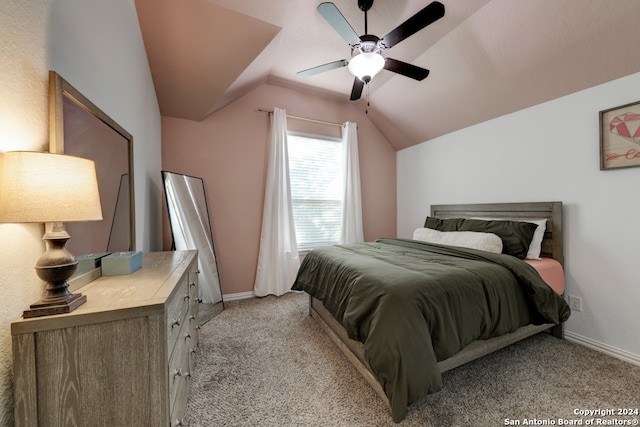 carpeted bedroom featuring ceiling fan and vaulted ceiling